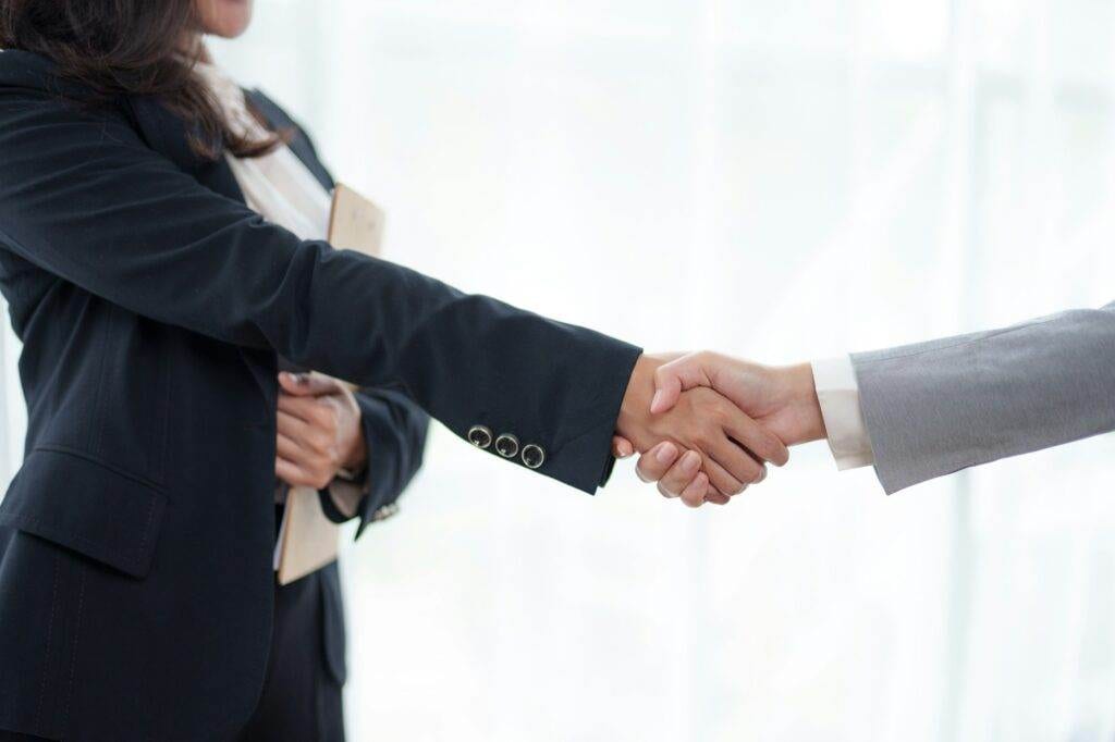 Business people join in congratulating them by แ in managing business in the organization. from join